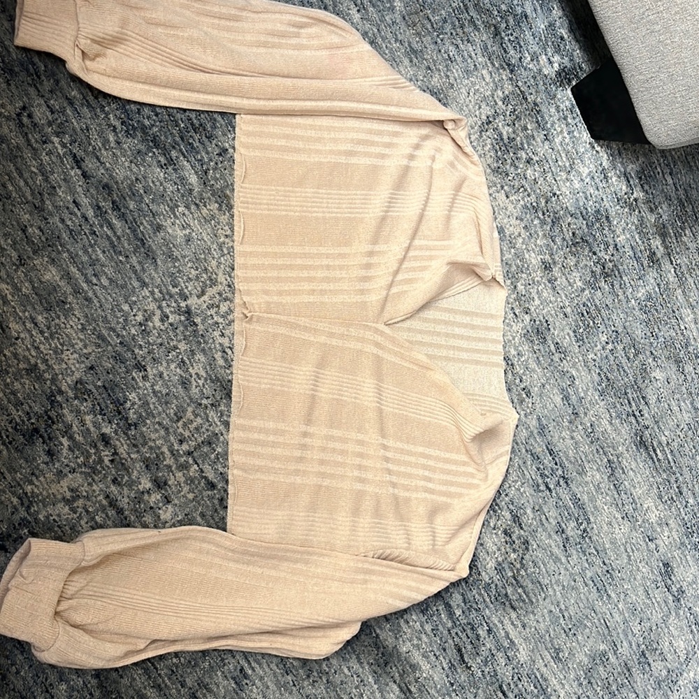 beige off the shoulder long sleeve shirt with slit down the middle